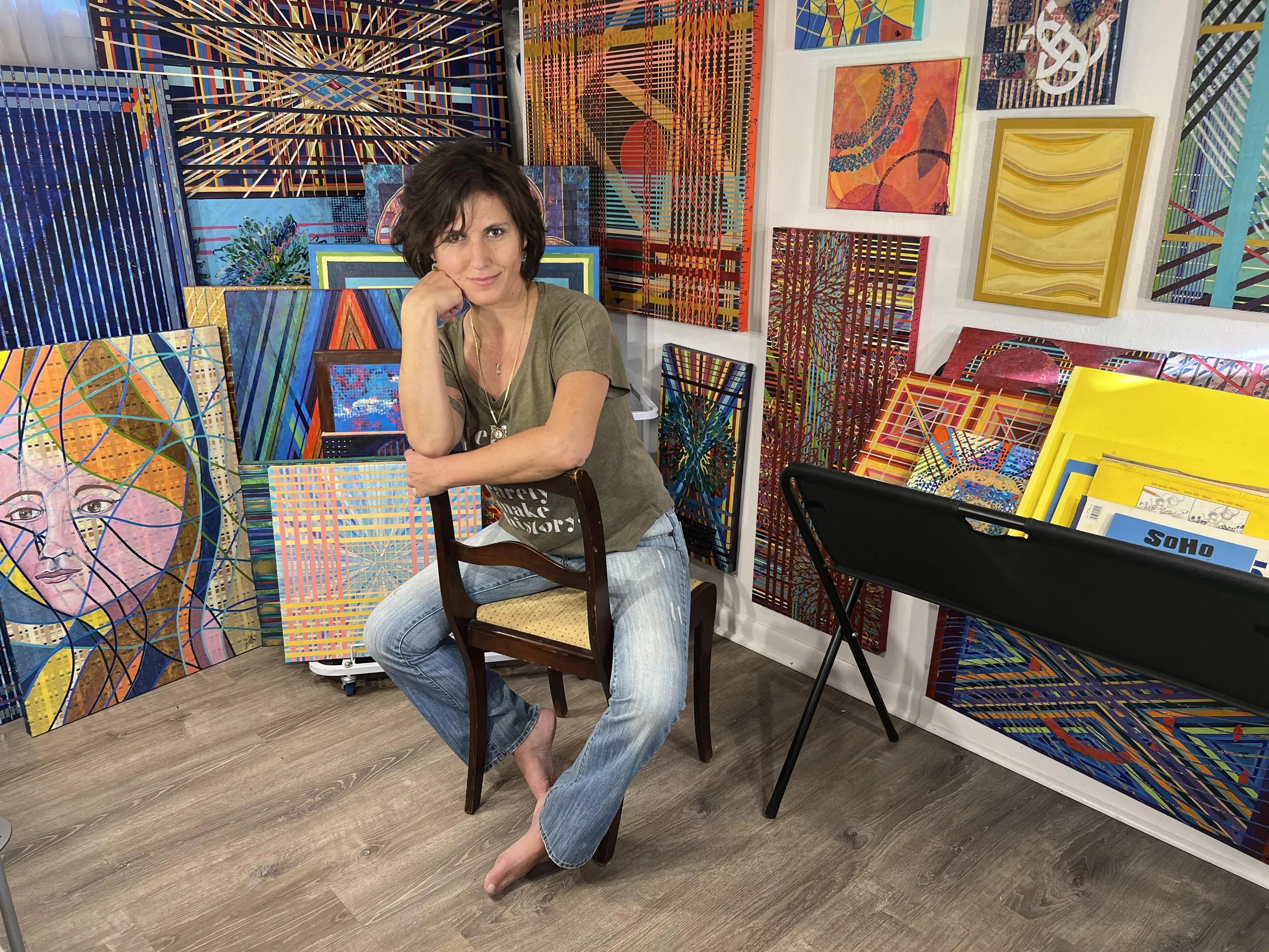 A woman poses in a studio.