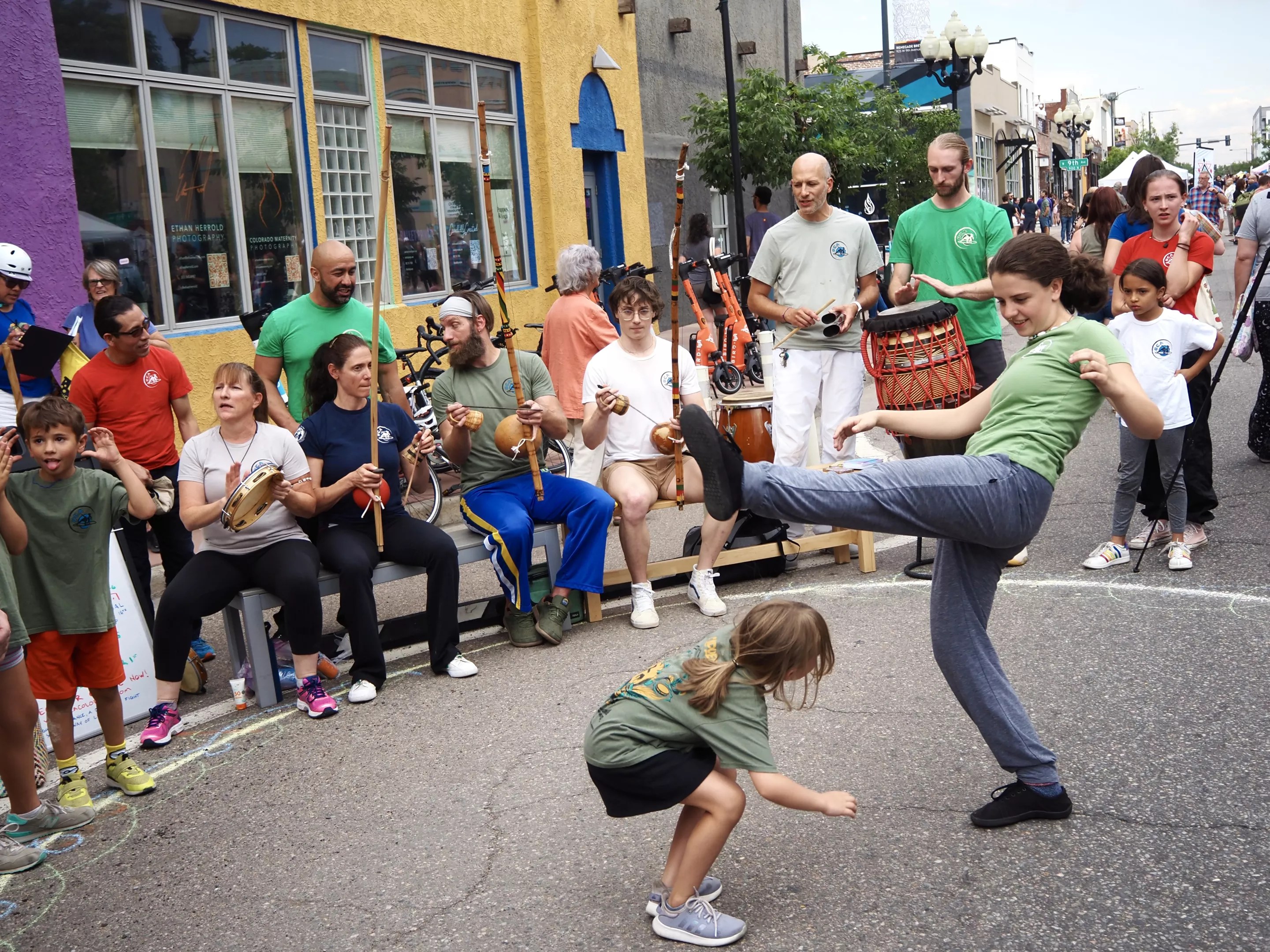 street dancers dance in a drum circle