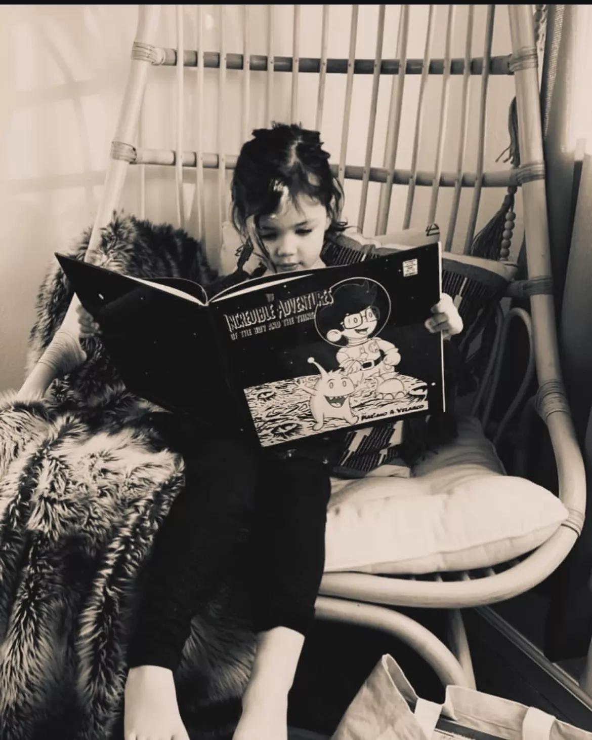 A girl reads a book