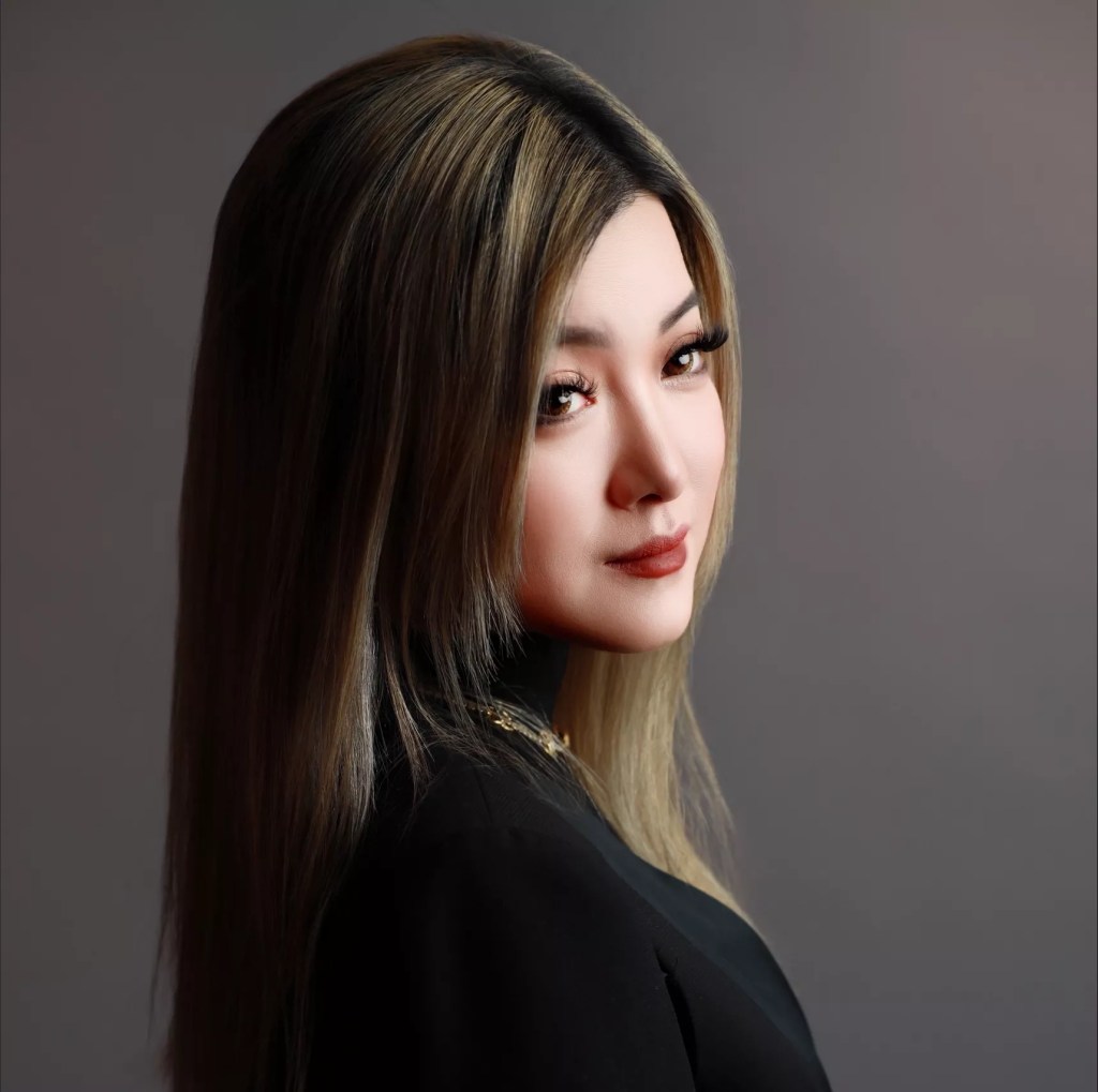 headshot of a woman in a black shirt